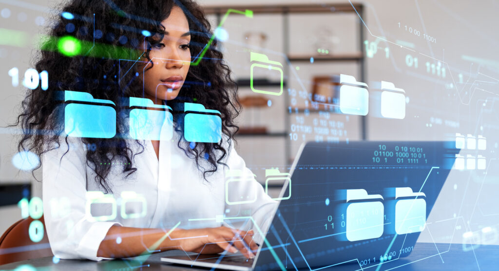 african woman with laptop using dms interface