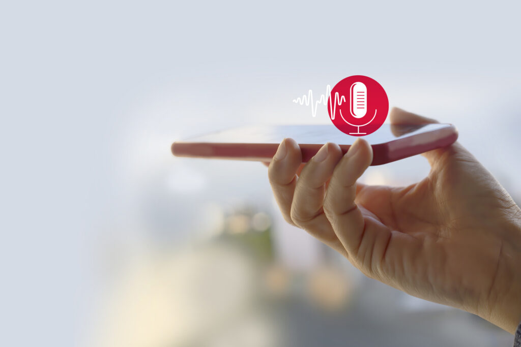 voice recording. hand holding microphone icon on smart phone. voice recognition with smart phone, audio, music, voice message. or use your voice to direct ai to search for information on internet. speech recognition concept.
