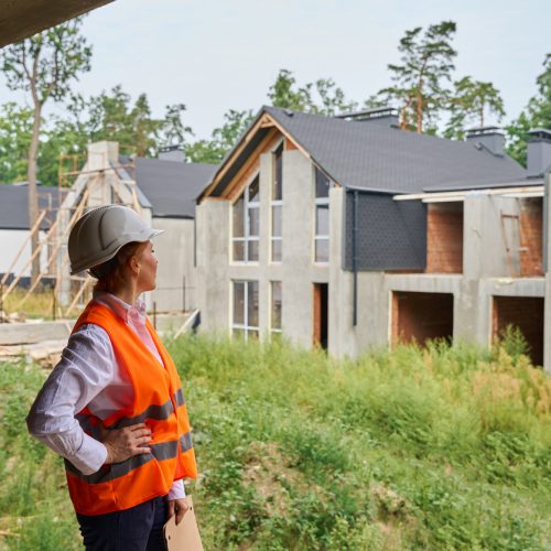 building inspector conducting visual inspection of residential development site